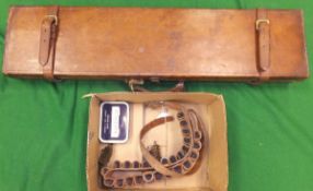 A leather motor case and box of various gun cleaning brushes and leather cartridge belt