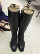 A pair of black leather riding boots with wooden trees, approx size 5½
 CONDITION REPORTS Wear,