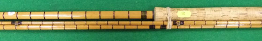 An un-named three piece split cane salmon fly rod together with ferrule stoppers