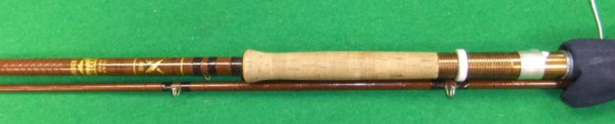 A Bruce & Walker "Spring Spinner" two piece fibreglass spinning rod,