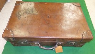 A vintage leather suitcase,