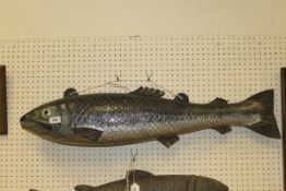 A painted metal shop sign as a salmon