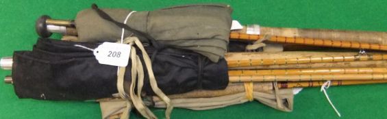 A collection of four vintage fishing rods to include a Sealey "General Practitioner" three piece