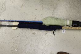 A "Tay Rod" 12 ft 2½ oz two piece spinning rod and two further fibreglass rods