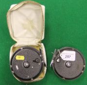 A pair of Shakespeare Beaulite salmon fly fishing reels, one in its maker's case.