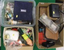 A large collection of assorted fishing tackle contained in three boxes.