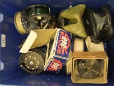 A box containing an assortment of reels including a boxed Allcock brass plate wind reel,