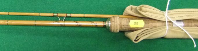 A Hardy "The Wanless" 6 lb two piece split cane spinning rod,