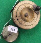 A small brass plate wind reel with an other example in wood.