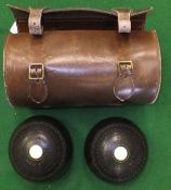 A pair of Jaques of London Crown King lawn bowls in a brown leather case