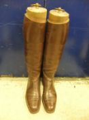 A pair of brown leather riding boots with wooden trees by Maxwell of London CONDITION REPORTS