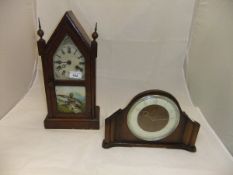 An early 20th Century American walnut cased mantel clock,