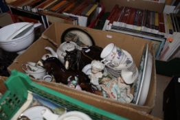 Three boxes of assorted china and glassware to include bisque figures, ornamental cats,