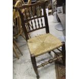 A set of five beech and elm rush seated dining chairs