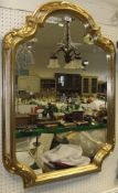 A modern painted and gilt framed wall mirror in the 18th Century Continental style