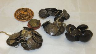 A collection of military and other buttons to include a set depicting a double headed dragon