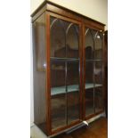 A 19th Century mahogany two door wall mounted glazed bookcase (possibly top of a secretaire