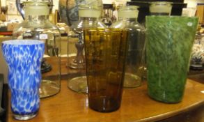 Four large glass apothecary jars, a green art glass vase with internal bubble decoration,