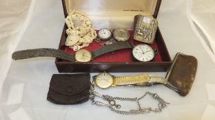 A box containing assorted pocket watches, tie pins, silver bound miniature prayer book, etc.