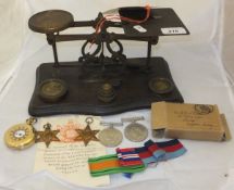 An early 20th Century set of brass postal scales on beech base,