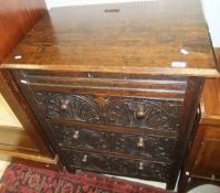 An oak three drawer chest, the drawers with carved decoration in the 17th century taste,