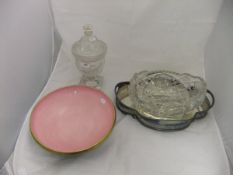 A 19th Century cut glass jar and cover, a large shaped oval cut glass bowl,