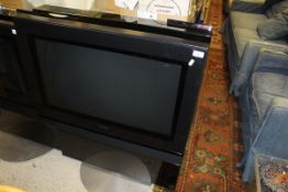 A Bang & Olufsen television with built in DVD video player,