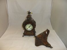 A Continental walnut cased ormolu mounted mantel clock,