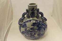 A large 20th Century Chinese blue and white crackleware decorated moon flask with dragon handles,