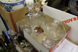 A box of assorted glassware to include decanters, basket, etc,