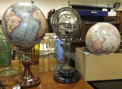 An Orrery raised on pedestal base formed as Atlas supporting the world, raised on black socle base,