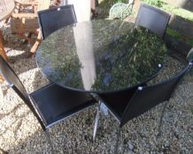 A polished black marble topped circular table on single chrome finished pedestal,