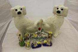 Two Victorian Staffordshire Spaniel ornaments with glass eyes, Staffordshire swan spill vase,