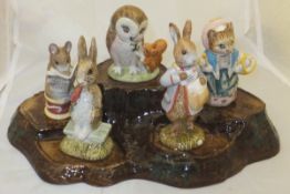 A Beswick tree trunk stand and five various figures including "Fierce Bad Rabbit" (1977),