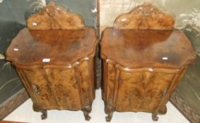 A pair of burr walnut veneered Dutch style walnut pot cupboards, raised on carved cabriole legs to