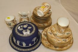 A Wedgwood blue jasperware cheese dish and cover and a 19th Century Staffordshire floral decorated