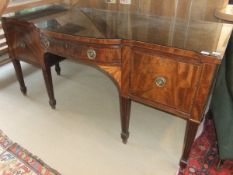 A Regency mahogany and inlaid breakfront sideboard,