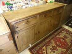 A Victorian pine dresser, the plain top with applied moulded edge above three drawers and three