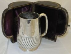 A silver mug inscribed "Pancake February 6th 1894",