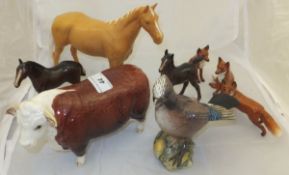 A collection of various Beswick animal figures including "Champion of Champions", Palomino gelding,