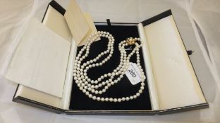 A twin strand cultured pearl necklace with 9 carat gold clasp