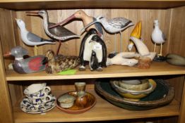 A collection of eleven various painted wooden bird figures in the manner of Michael Lythgoe,