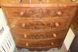 A Victorian mahogany bow fronted chest of two short and three long graduated drawers with shaped