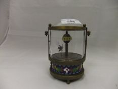 A brass mounted automaton clock with cloisonné decorated base