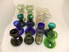 A collection of hyacinth glasses to include a pair with green and iron red marbled overlaid