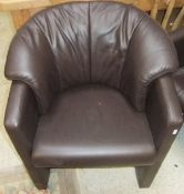 A set of four modern brown leather upholstered tub chairs