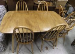 An Ercol extending dining table and six stick back chairs CONDITION REPORTS Table approx 90cm
