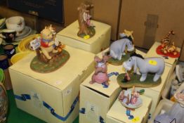 A collection of seven Disney "Pooh and Friends" figures