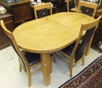 A modern oak D end extending dining table,