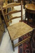 A set of five 19th Century ash bar back dining chairs with rush seats